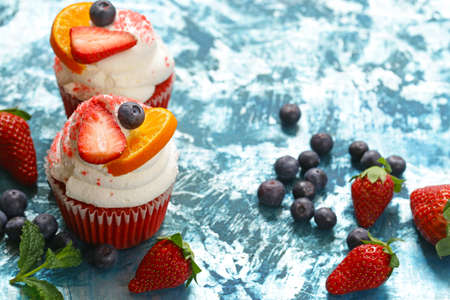 festive cupcakes with berries and butter cream
