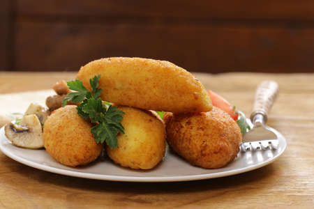 Vegetarian potato cutlets  with vegetable saladの写真素材
