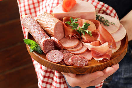 Assortment of meat delicacies (salami, parma, ham)の写真素材