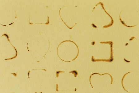 Abstract stains from chocolates on a beige backgroundの写真素材