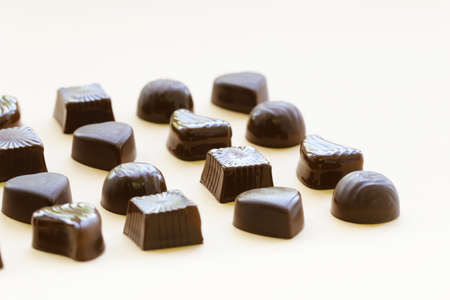Chocolate candy - dessert on a beige background