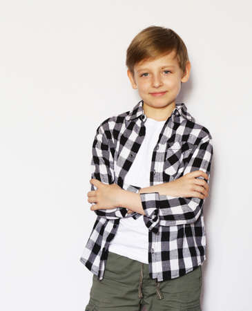 Cute blonde boy in casual clothes posingの写真素材