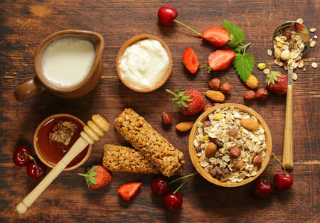 Healthy breakfast with homemade granola, berries and muesli barsの写真素材