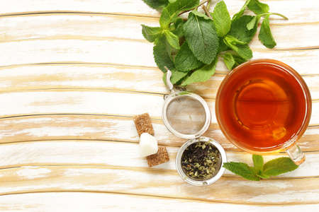 Refreshing tea with mint in a cup on the tableの写真素材