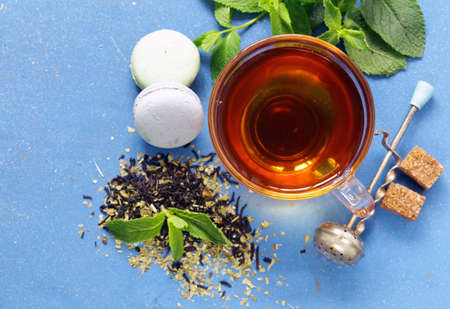 Refreshing tea with mint in a cup on the tableの写真素材