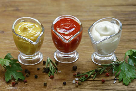 Different types of sauces in glass gravies