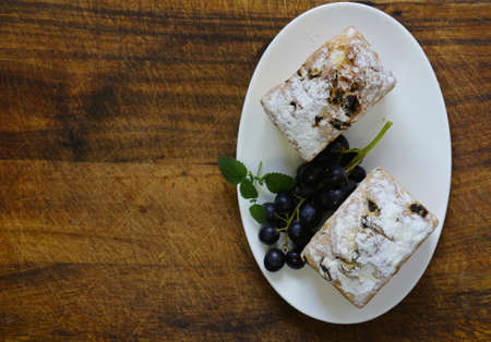 Pound cake with raisins and powdered sugarの写真素材