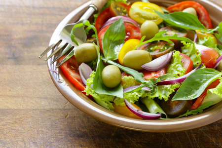 Mediterranean salad with olives, avocado and tomatoesの写真素材