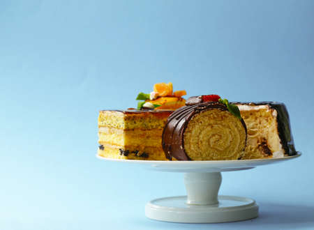 Assorted mini cakes sweet dessert, chocolate and fruitの写真素材