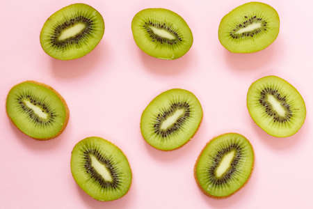Organic green kiwi fruit sliced into slicesの写真素材