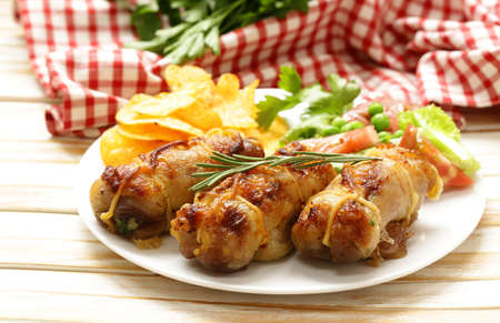 Roast rolls of chicken fillet with herbsの写真素材