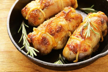 Roast rolls of chicken fillet with herbsの写真素材