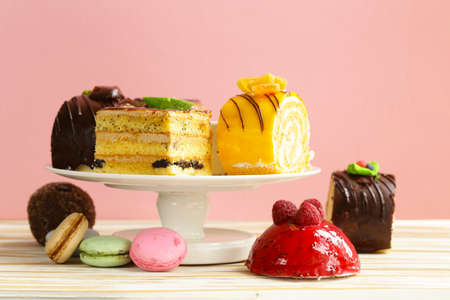 Assorted mini cakes sweet dessert, chocolate and fruitの写真素材