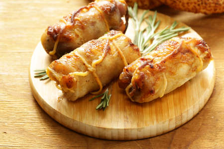 Roast rolls of chicken fillet with herbsの写真素材