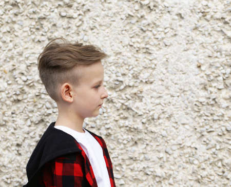 Portrait of a blonde boy casual style, fashionable haircutの写真素材