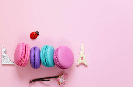 Traditional French macaroons almond cookies composition on a pink backgroundの写真素材