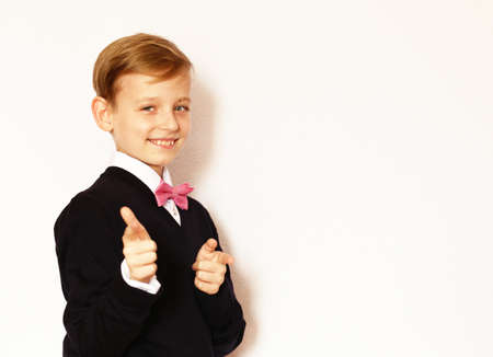 portrait of a boy in a classic suit with a bow tieの写真素材