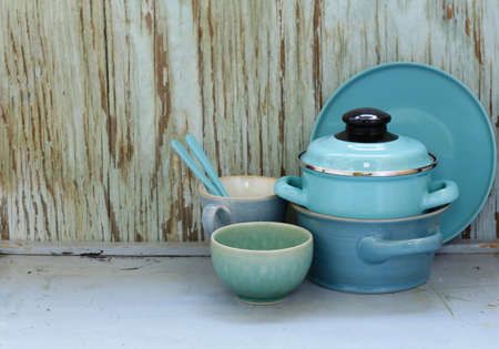 kitchen utensils, cooking pans on a wooden background, rustic styleの写真素材