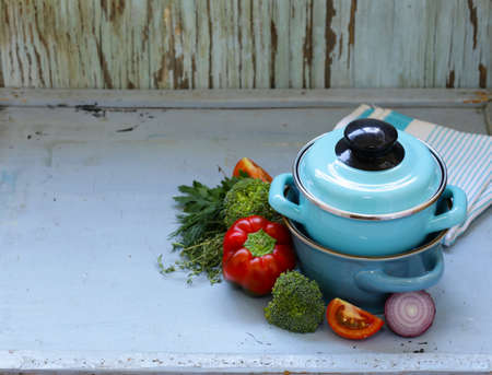 kitchen utensils, cooking pans on a wooden background, rustic styleの写真素材
