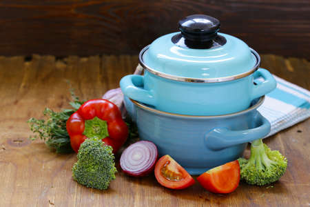 kitchen utensils, cooking pans on a wooden background, rustic styleの写真素材