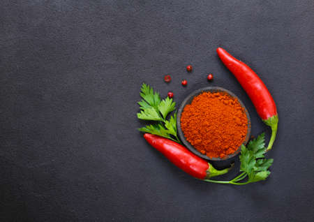 red ground paprika and fresh chili peppersの写真素材