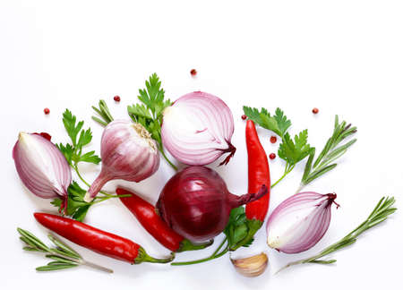 Food background - red onion, garlic, pepper, vegetables and herbsの写真素材
