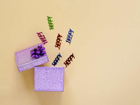 lilac gift box on a beige backgroundの写真素材