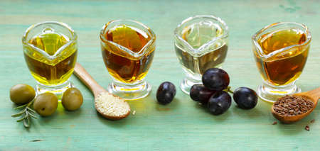 various types of vegetable oil - sesame, olive, linseed and grape seedsの写真素材