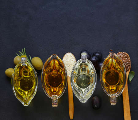 various types of vegetable oil - sesame, olive, linseed and grape seedsの写真素材