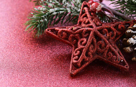 Christmas decorations on a red shiny festive backgroundの写真素材