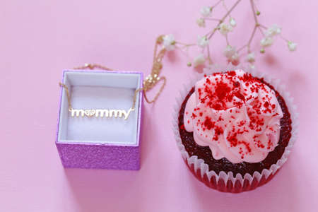 Happy Mothers Day! Dessert cupcakes and gift on holiday for mom