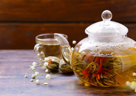 green tea flower (celestial lily) in a glass teapotの写真素材