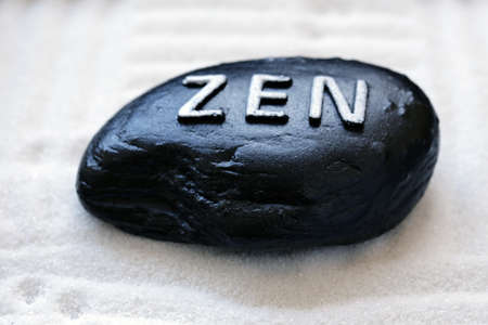 stone with the inscription Zen - a symbol of peace and balance
