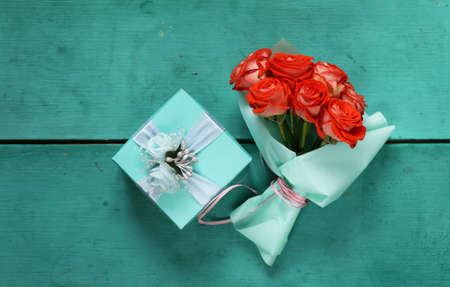 turquoise gift box and rose flowers for holiday