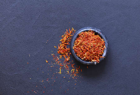 Traditional aromatic spice saffron in a mortarの写真素材