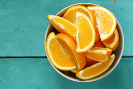 ripe organic orange sliced into slices