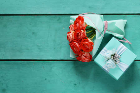 turquoise gift box and rose flowers for holidayの写真素材