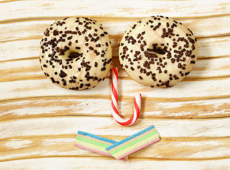 sweet donuts with sugar and chocolate colored glaze