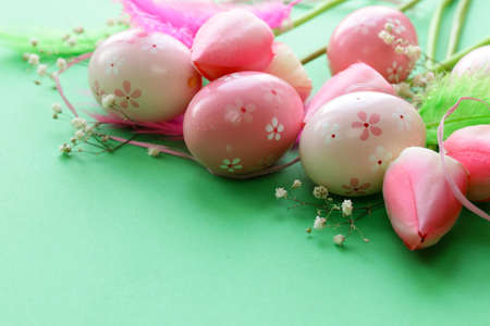 Easter decoration with flowers and painted eggsの写真素材