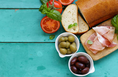 Parma ham, black and green olives - traditional foodの写真素材