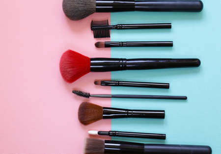 set of various makeup brushes on a pastel backgroundの写真素材