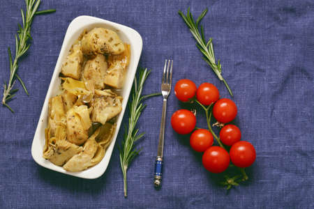 Preserved grill artichokes in oil with spices and herbs