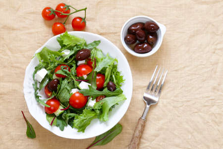 fresh salad with tomatoes and feta cheeseの写真素材