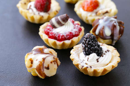 Mini dessert tarts sweet pastries for the holidayの写真素材