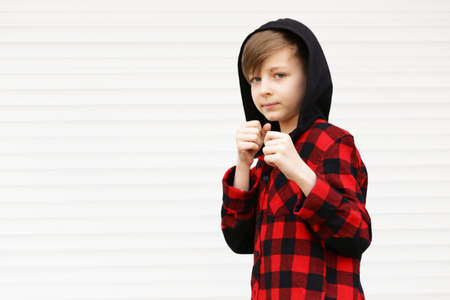 Blond cute boy in casual clothes posing on white backgroundの写真素材