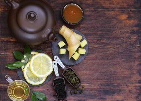 aromatic tea in a teapot on a wooden backgroundの写真素材