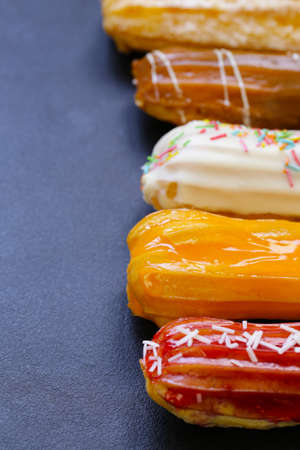 dessert cakes sweet eclairs with different glaze