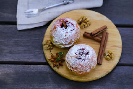 baked apples with cinnamon and powdered sugarの写真素材