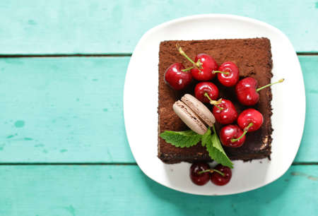 super chocolate truffle cake with fresh berriesの写真素材