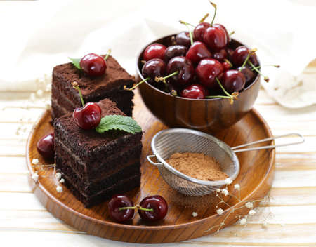 super chocolate truffle cake with fresh berriesの写真素材